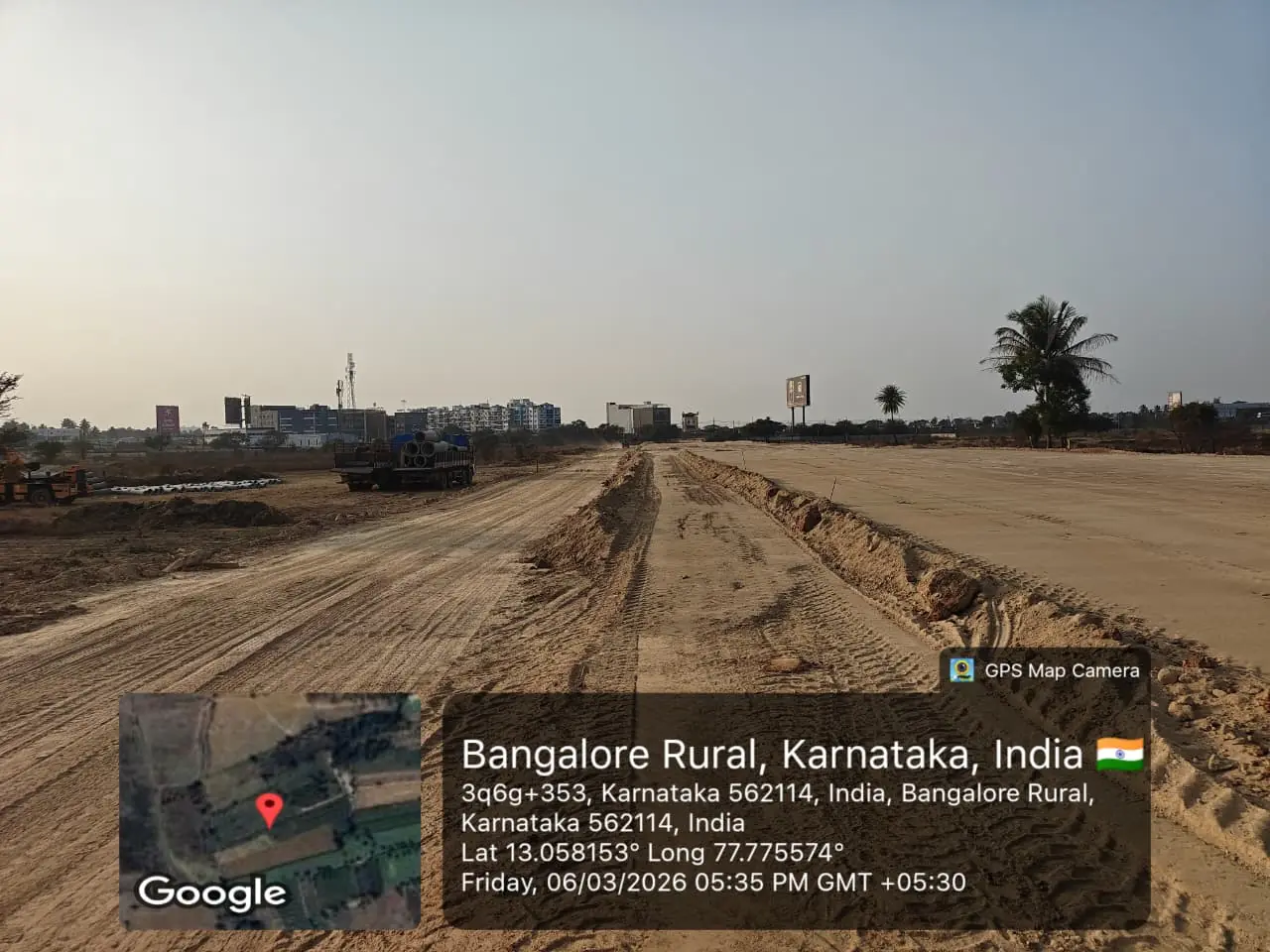Featured Image of Sobha One World Site Progress March 2026 - graded internal access road with precast drainage pipes staged, GPS-stamped Amanidoddakere