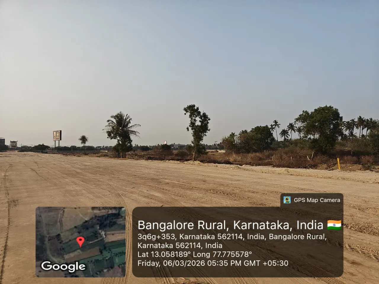 Featured Image of Sobha One World Site Progress March 2026 - levelled site with billboard and tree line visible, GPS-stamped Amanidoddakere