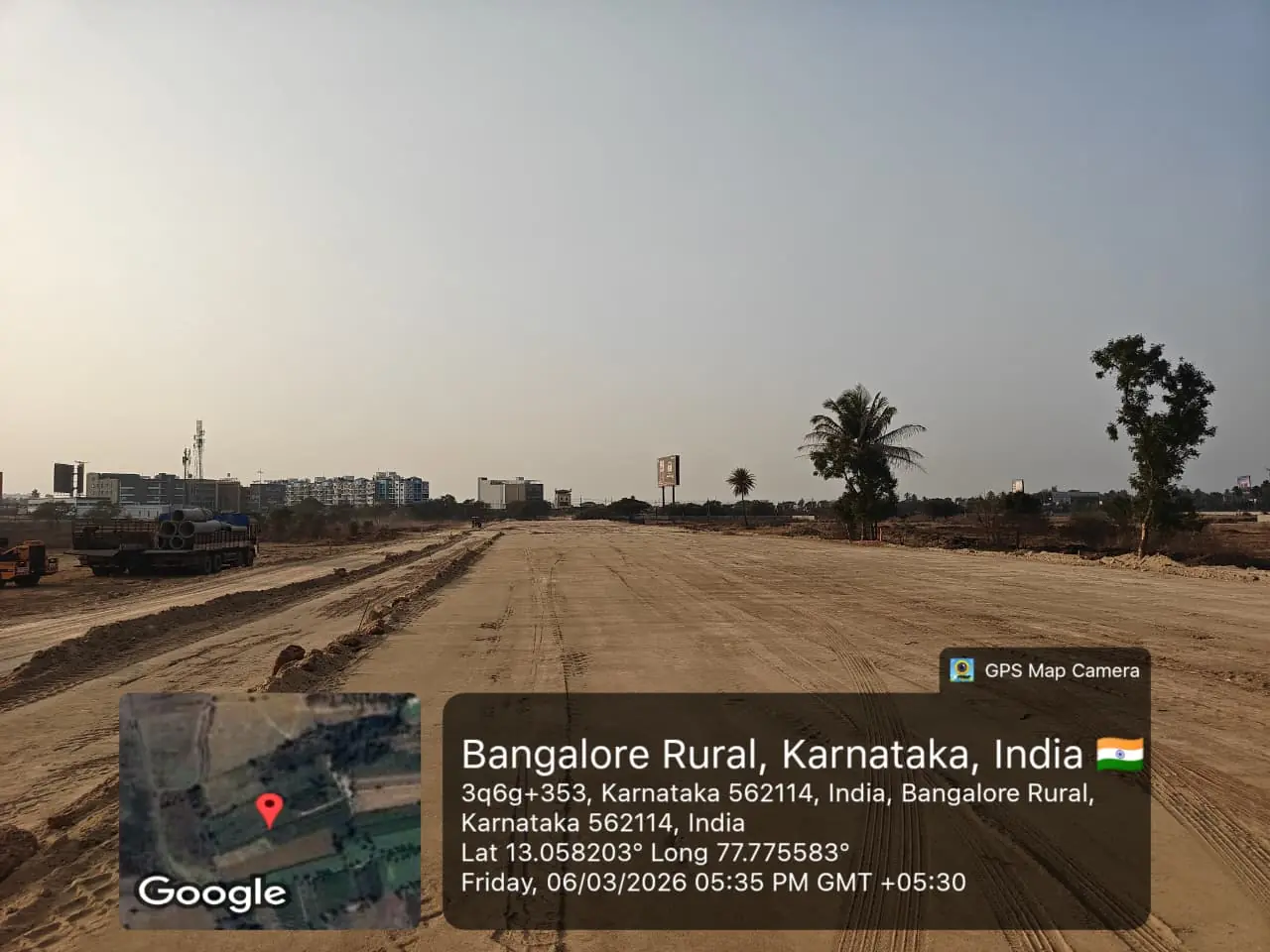 Featured Image of Sobha One World Site Progress March 2026 - wide graded site with Hosakote development skyline in the background, GPS-stamped Amanidoddakere